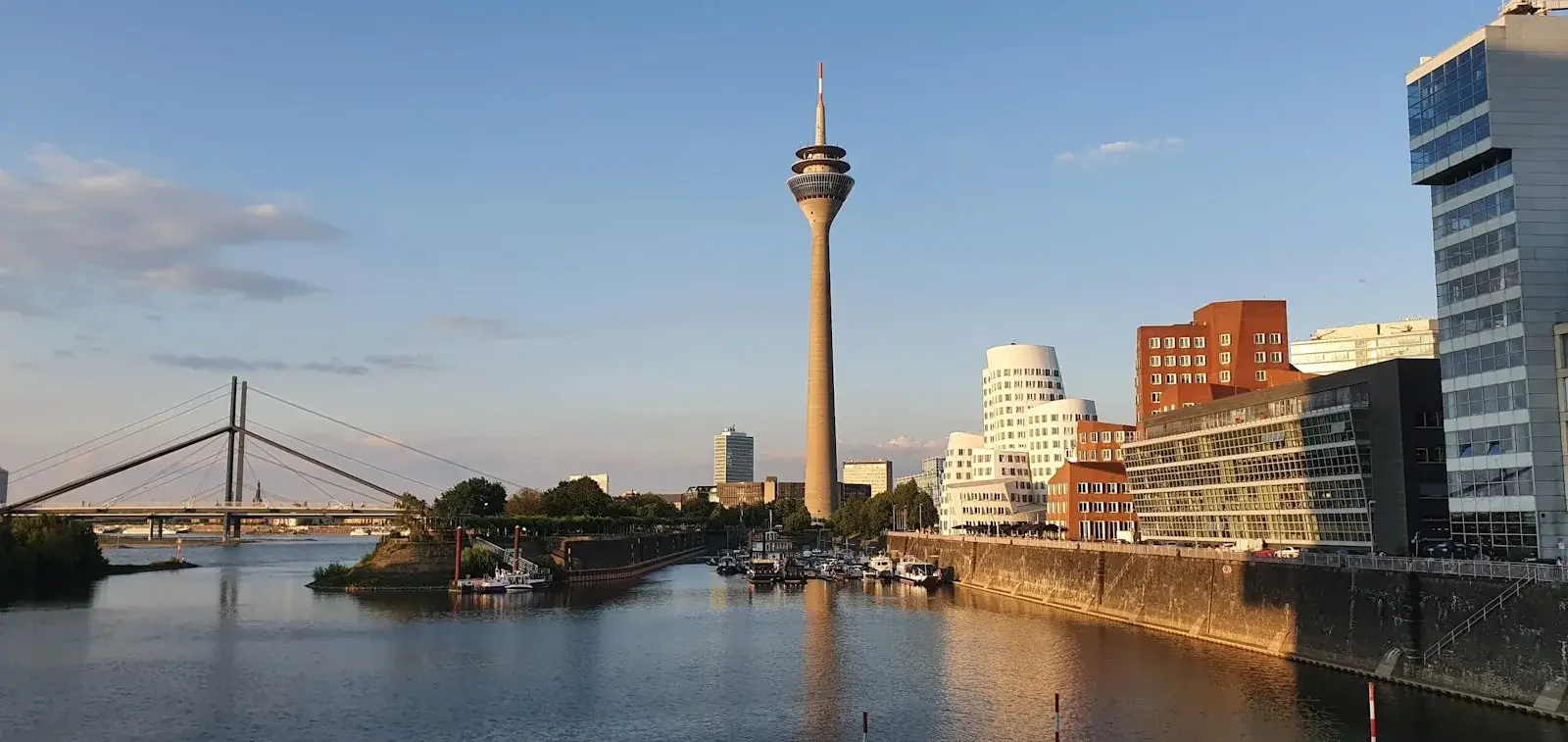 Düsseldorf: Rhine Tower and Media Harbour seen from the river bank